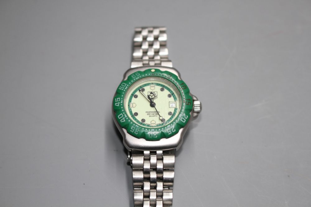 A ladys stainless steel Tag Heuer Professional quartz wrist watch, on Tag bracelet.